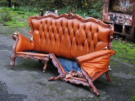 Company van delivering skip for hire at a site